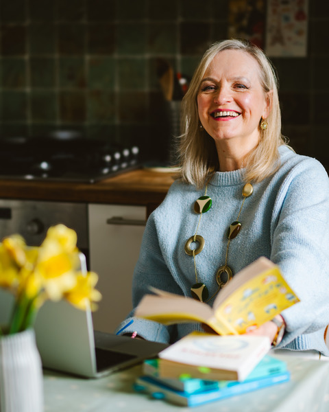 Elaine Newton is pictured wearing a pale blue jumper and smiling.