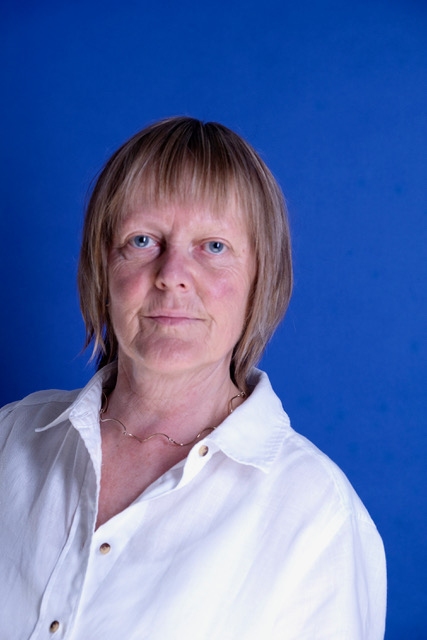 Tina Norris is pictured wearing a white shirt.